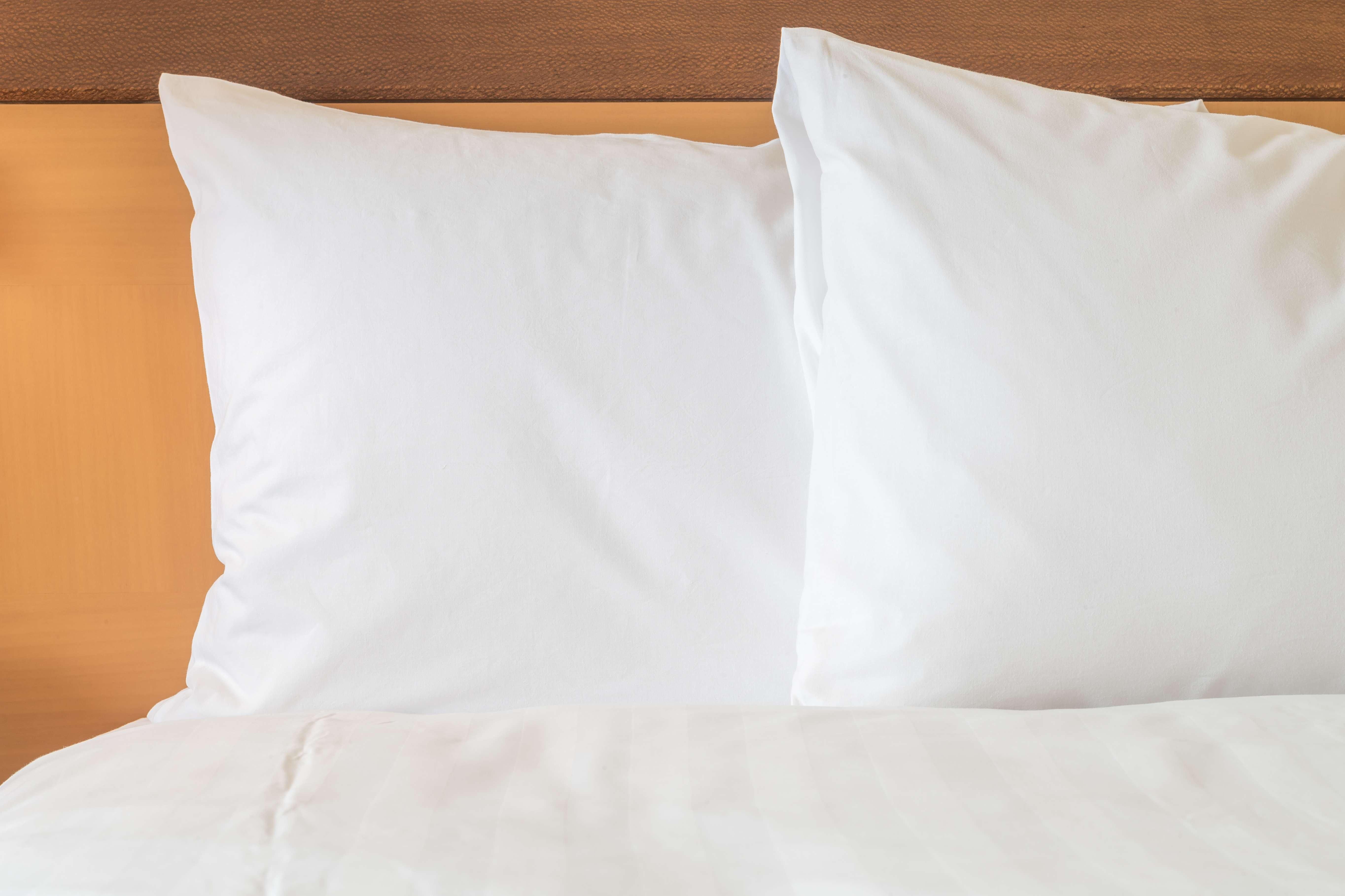 Intercontinental Miami By Ihg Hotel Exterior photo Two pillows on a bed